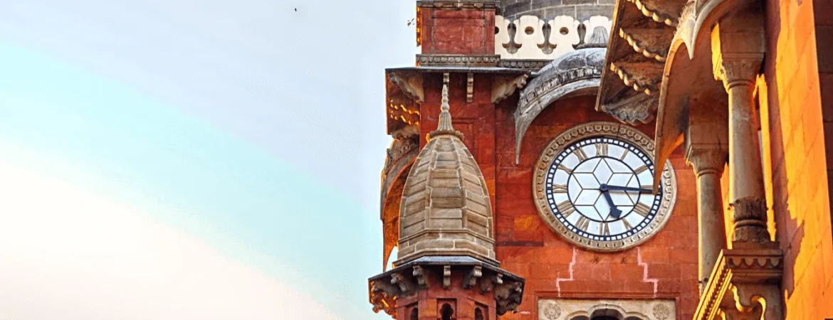 Rajwada Palace clock tower showcasing Indo-Gothic architecture in Indore, Madhya Pradesh.