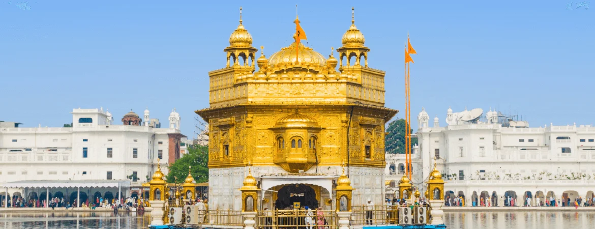 Golden Temple in Amritsar, Punjab, India, famous Sikh pilgrimage site and stunning example of golden architecture reflected in the holy water.