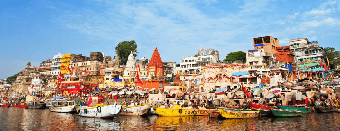 Colorful boats at Dashashwamedh Ghat on the banks of River Ganga in Varanasi, India.